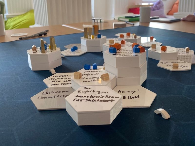 A completed 3D Worlds map on a workshop table